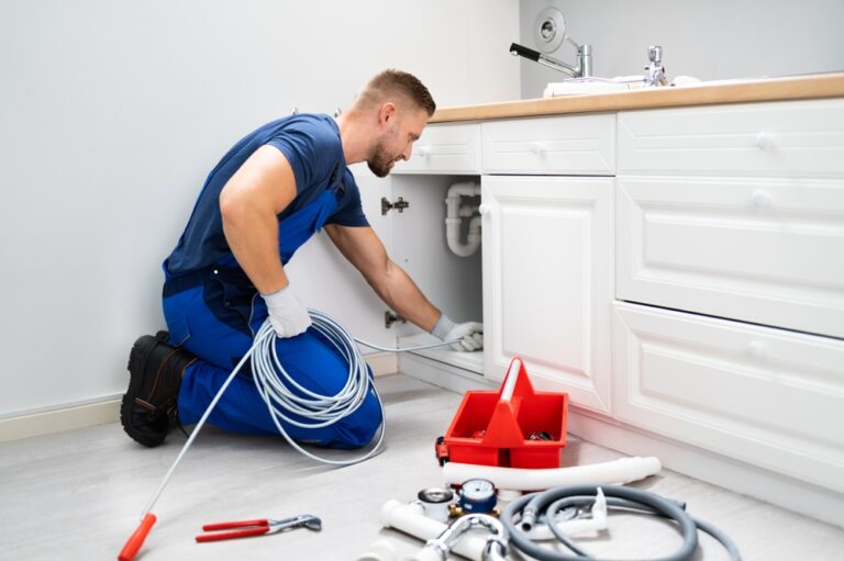 Male,Plumber,Cleaning,Clogged,Sink,Pipe,In,Kitchen